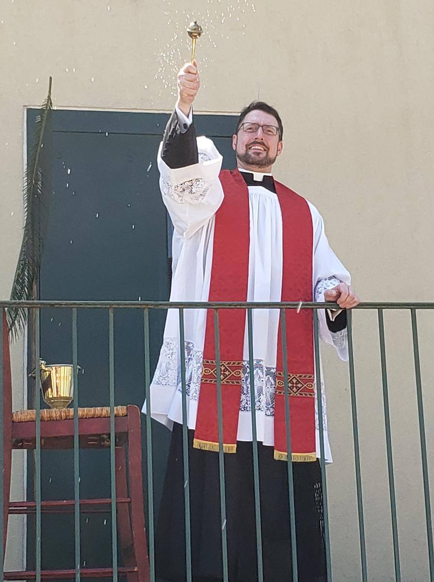 Parishioners at St. Michael Church in Gastonia got a blessing with holy water from Father Lucas Rossi during a “Parade-a-Palms” April 5.