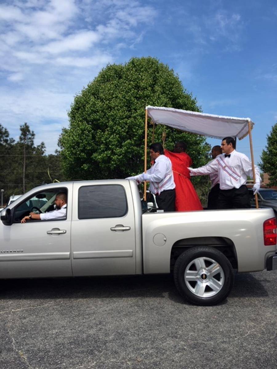 With the help of parishioners and a pickup truck, Father Jean Pierre Swamunu Lhoposo, pastor of St. James Church in Hamlet, led a Eucharistic procession through Hamlet and nearby Rockingham