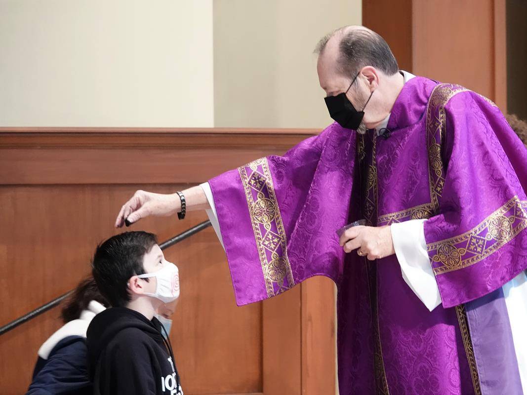 HUNTERSVILLE — Ash Wednesday Mass was celebrated at St. Mark Church. (Photos provided by Amy Burger.)