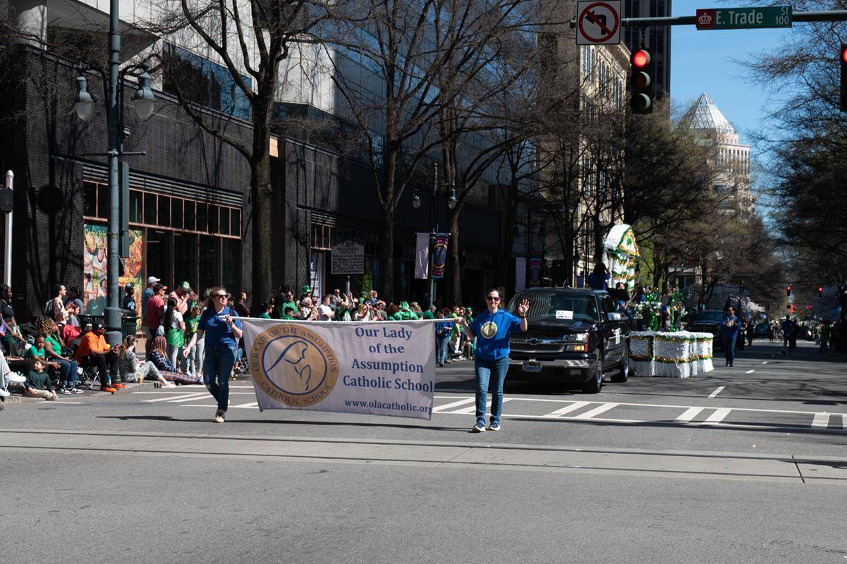 Students, staff and family of Our Lady of the Assumption march in the parade.