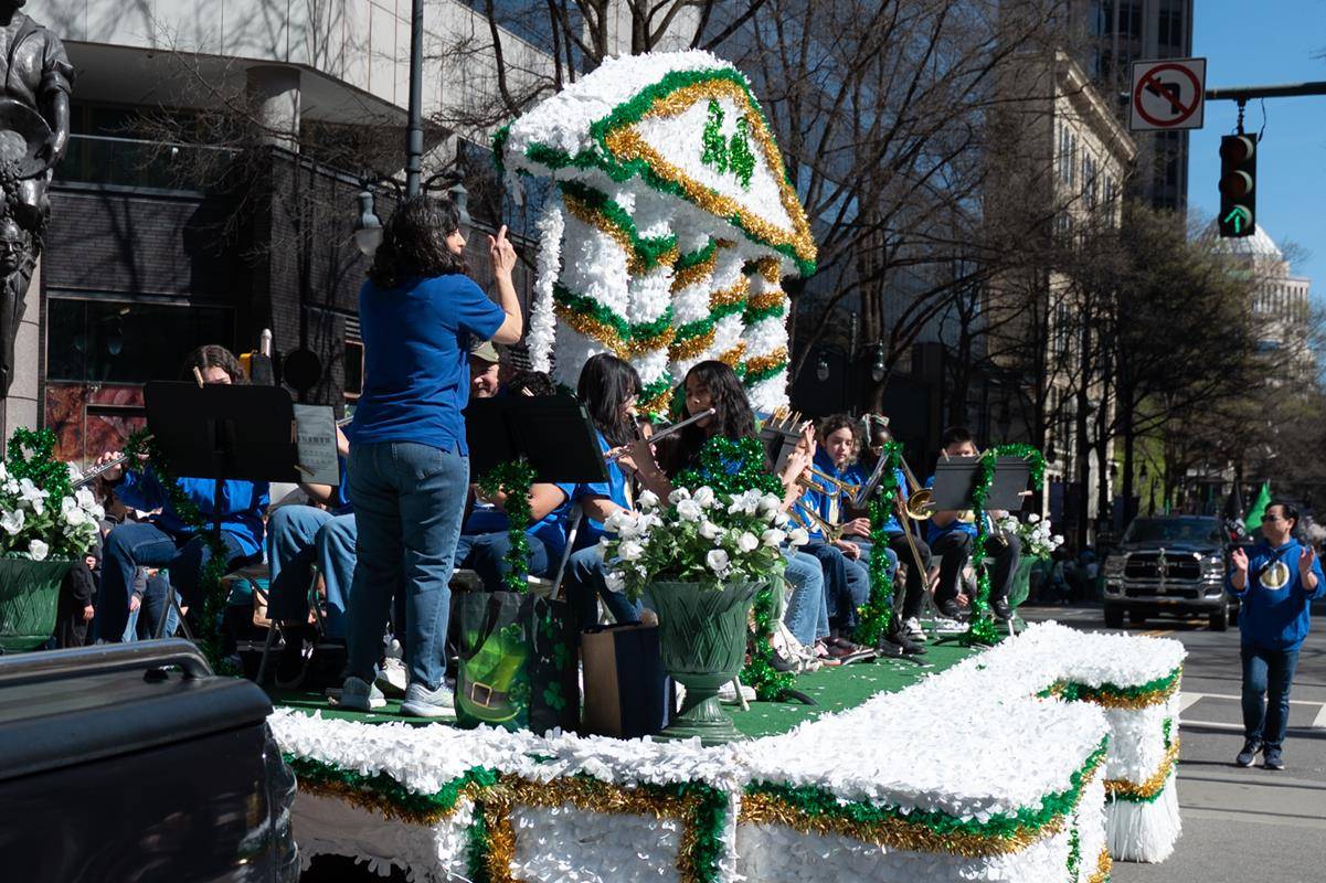 Students, staff and family of Our Lady of the Assumption march in the parade.
