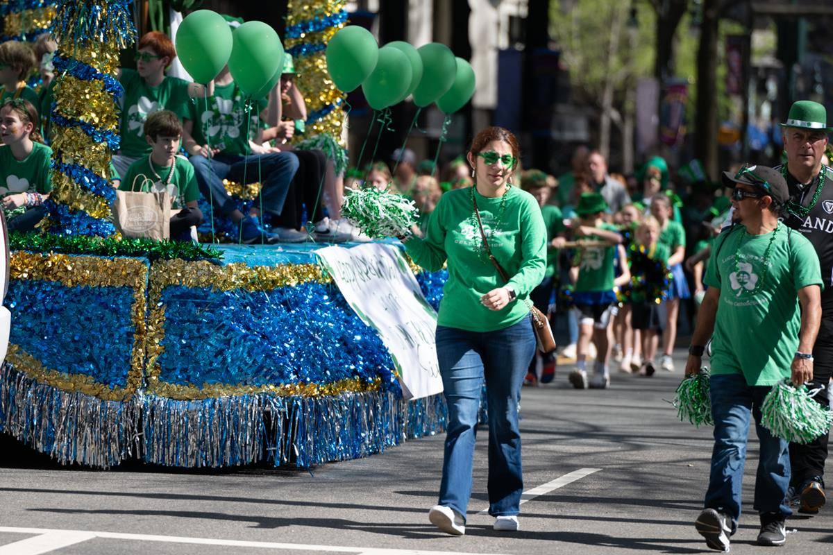 Students, staff and family of St. Ann school march in the parade.