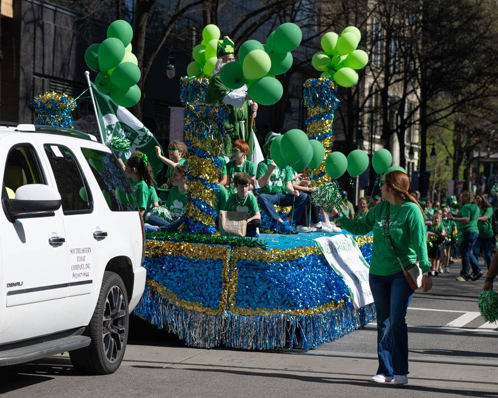 Students, staff and family of St. Ann school march in the parade.