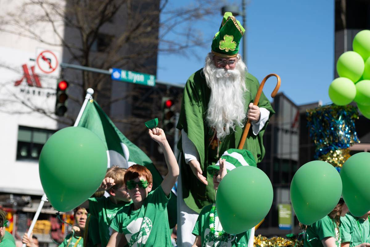 Students, staff and family of St. Ann school march in the parade.