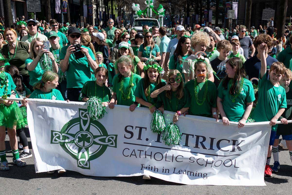 Students, staff and family of St. Patrick school march in the parade.
