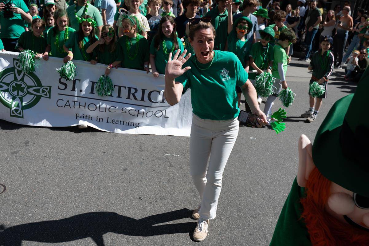 Students, staff and family of St. Patrick school march in the parade.