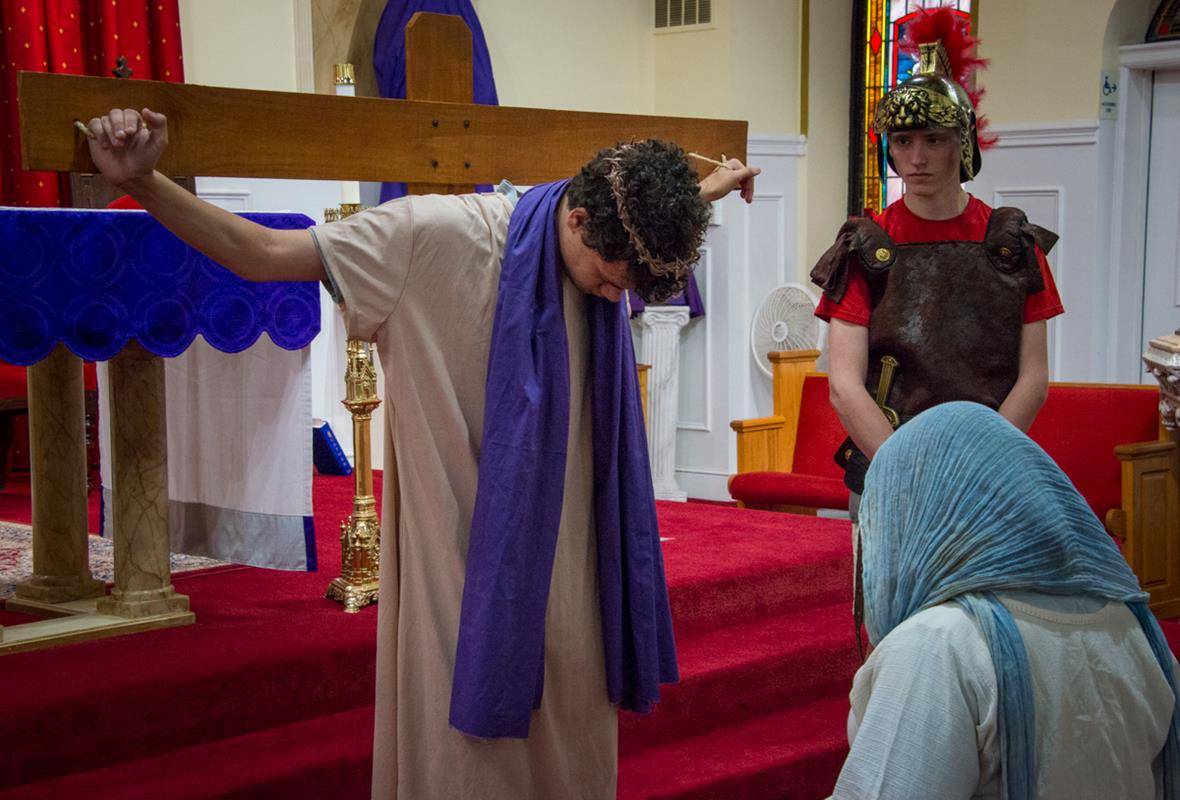 DENVER —They moved from the back to the front of the church as each station was read by another teen. (Photos by Doreen Sugierski | Catholic News Herald)