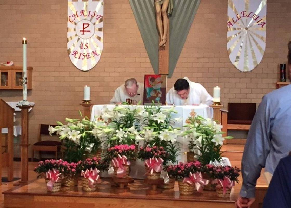 MURPHY — Father Alex Ayala and Deacon Carl Hubbell celebrate Easter Sunday Mass. (By Craig Allen)
