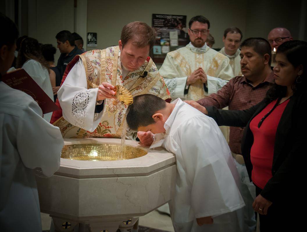SALISBURY — Easter Vigil Mass at Sacred Heart Church with Father John Eckert. (By Bill Washington)