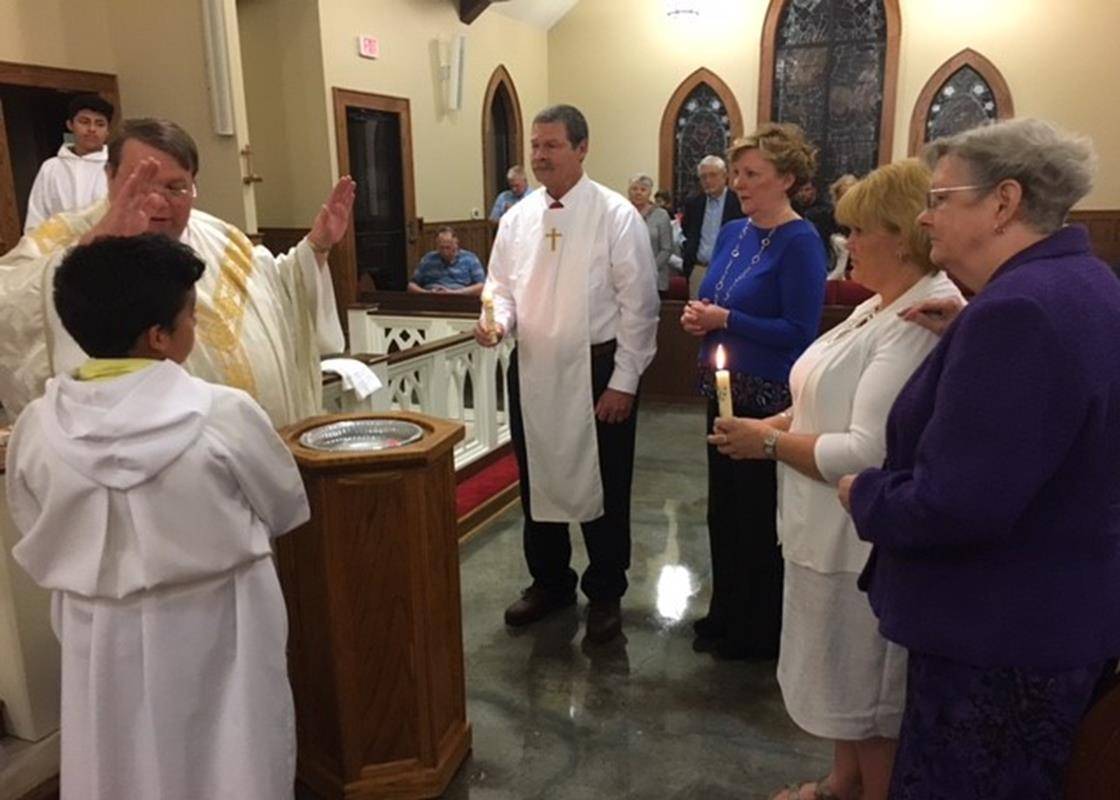 JEFFERSON – Brian Wood received Baptism and he and Shana Dillard received Confirmation at the bi-lingual Easter Vigil Mass. Wood is a member of St. Francis of Rome in Sparta and Dillard is a member of St. Francis of Assisi in Jefferson. (Patrick Hession)